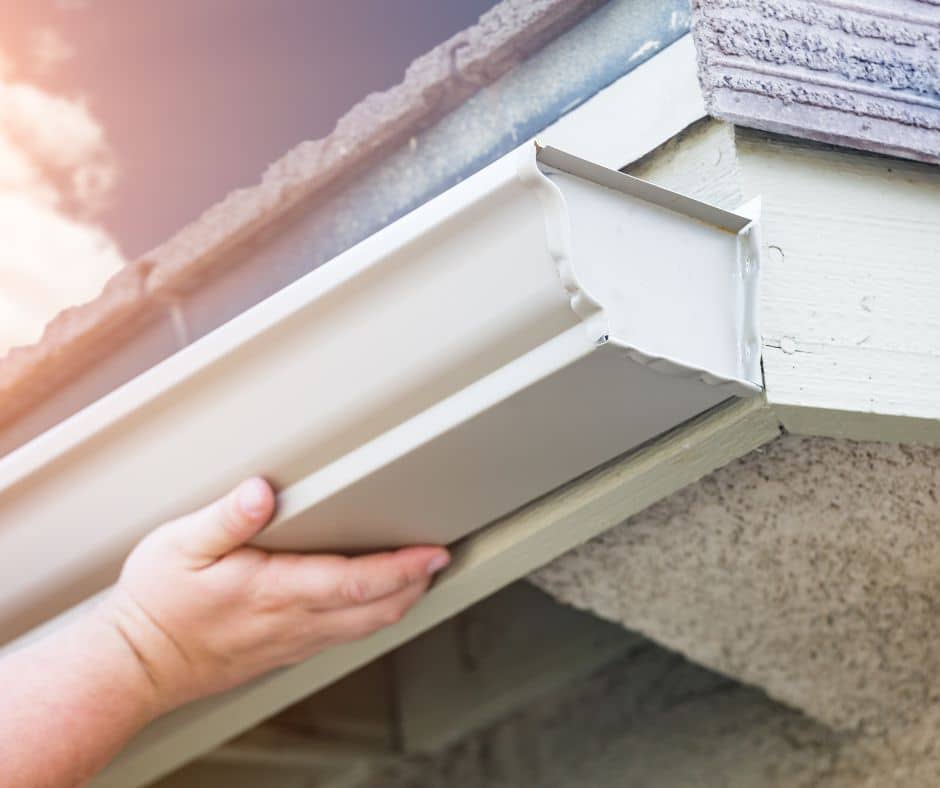 a person holding a gutter