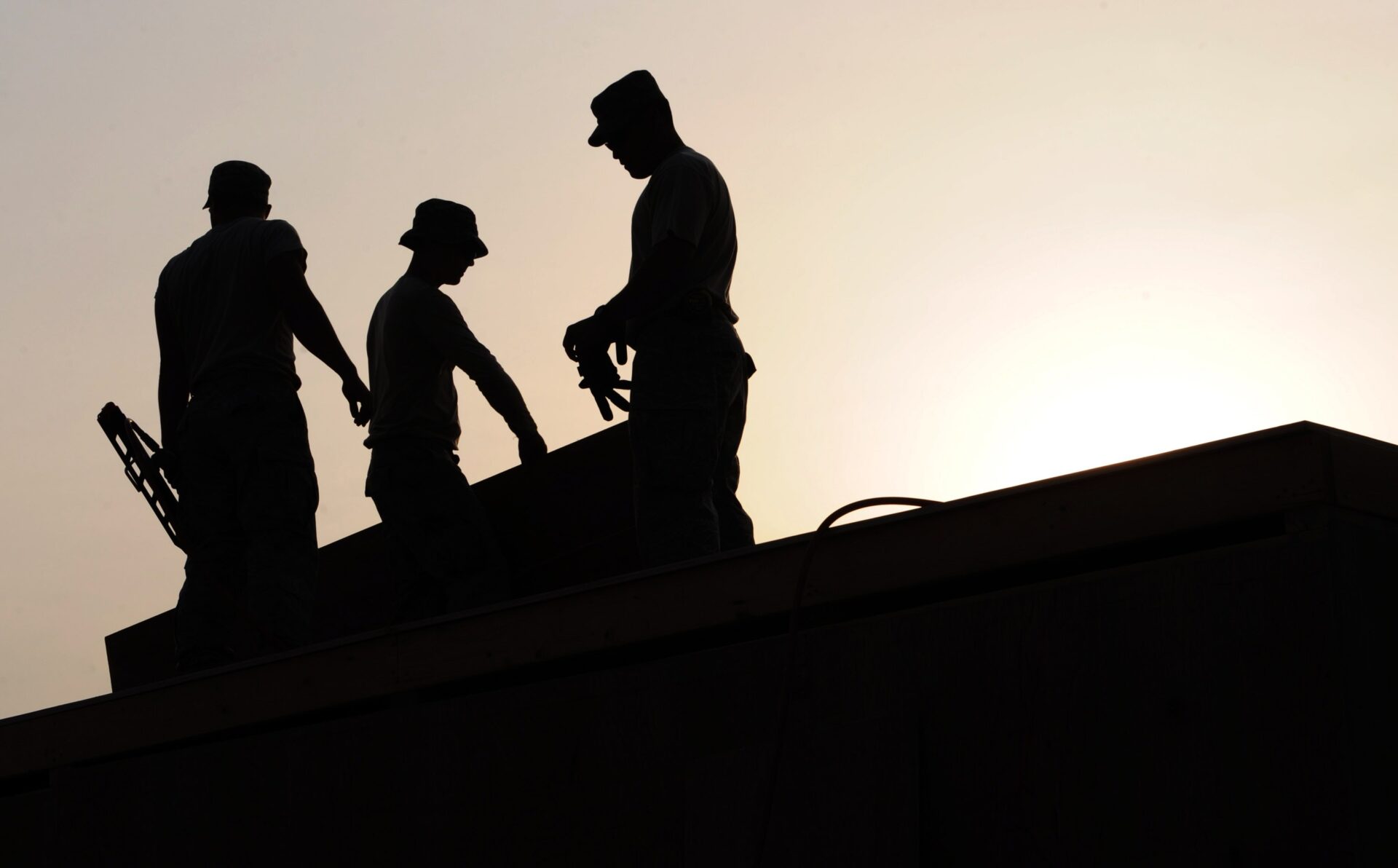 a silhouette of trusted Winnipeg Roofing experts