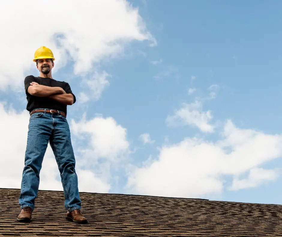 the man of one of the best winnipeg roofing companies standing on a roof