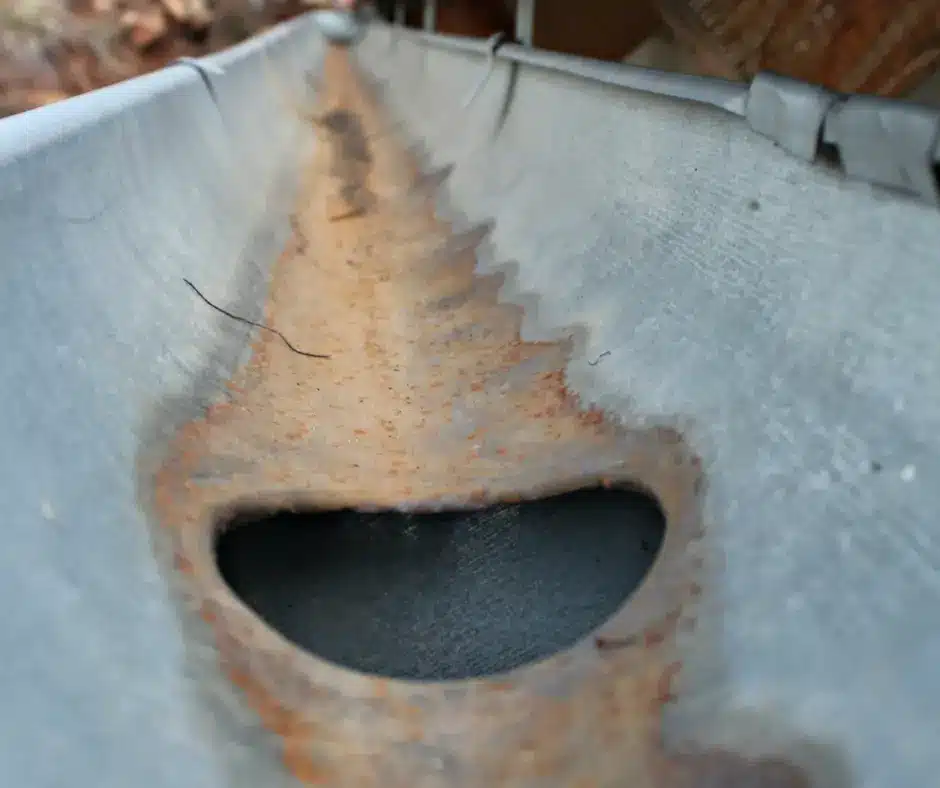 a close up of a rusty eavestrough - signs for an eavestrough replacement