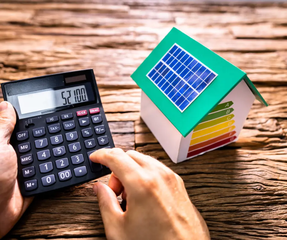 calculator and a miniature house 