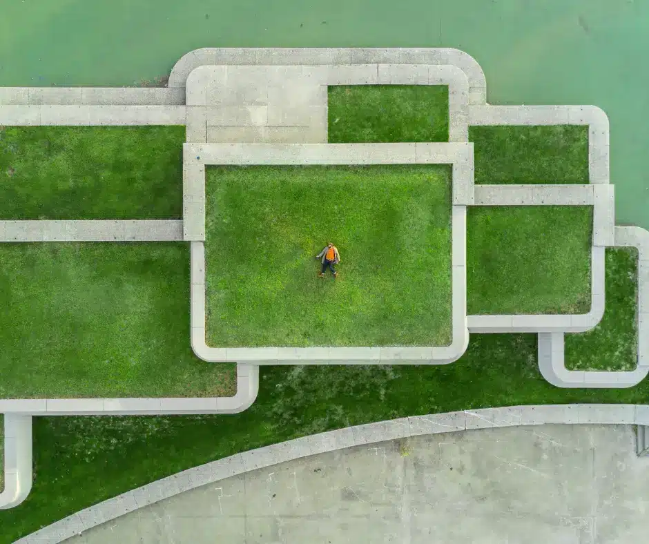 a person lying on a green roof - a new Winnipeg roofing technology