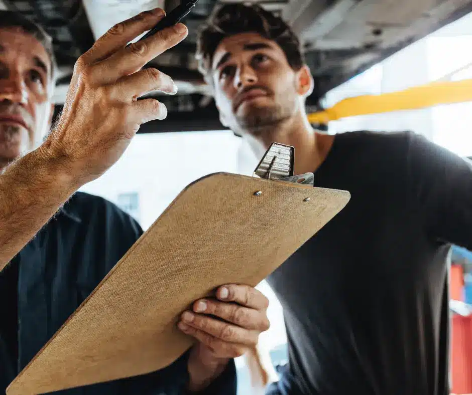 a man holding a clipboard and pen looking up