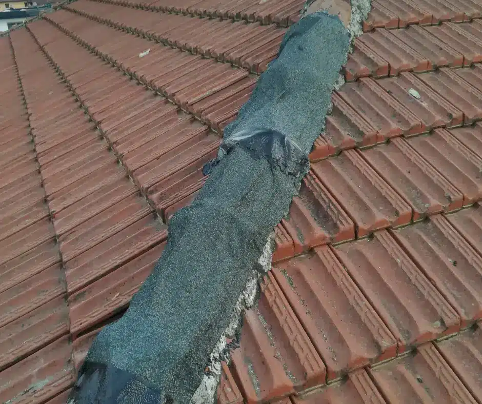 a roof with a patch to seal the roof blisters