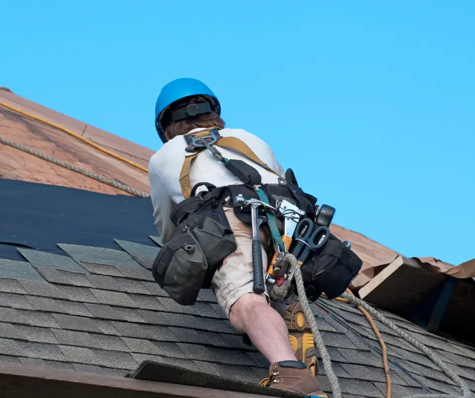 a man climbing a roof