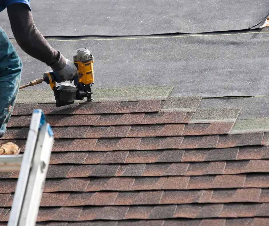 a person using a tool to fix a roof