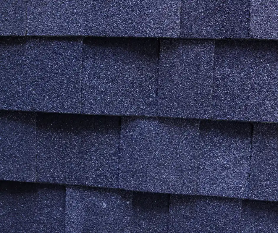 a close up of a blue shingle roof