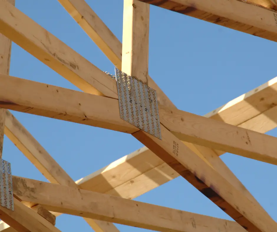 a wooden structure with metal studs