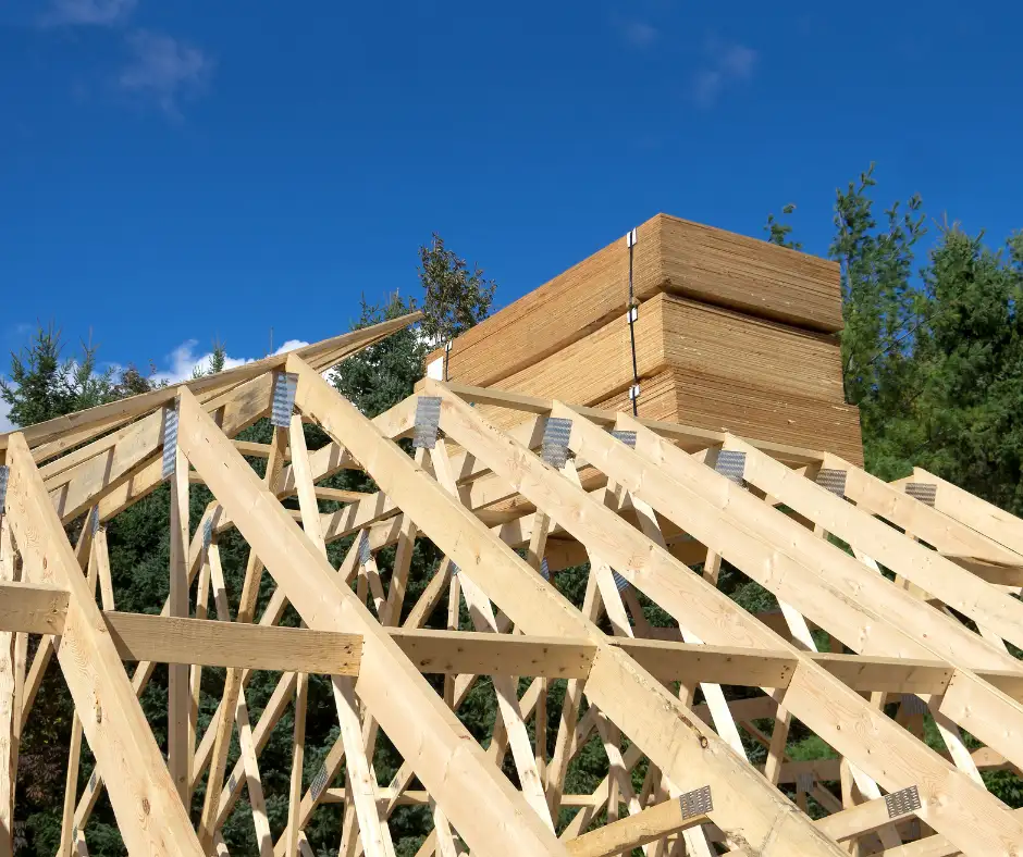 a wooden structure with a stack of wood