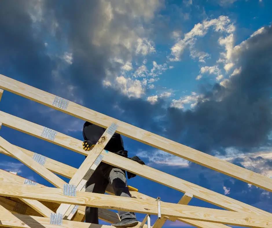 an expert roofer building roof trusses