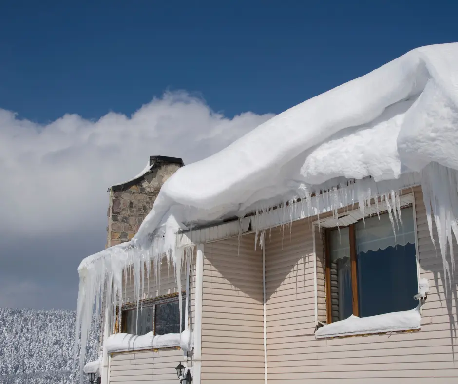 a house with snow on the roof