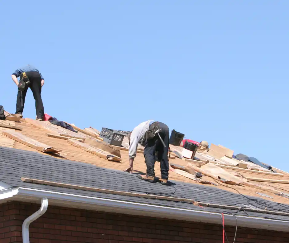 a group of men working on a roof