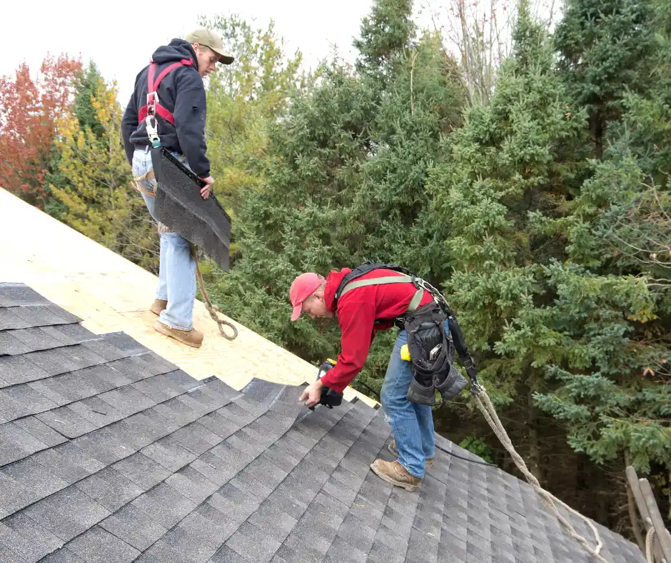 a group of men working on a roof