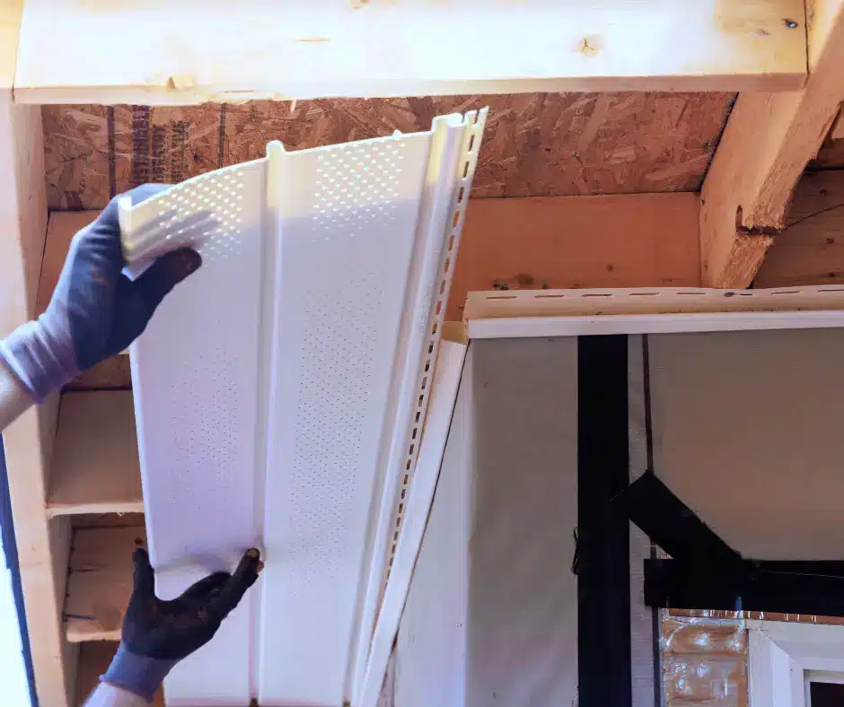 a person holding a white soffit