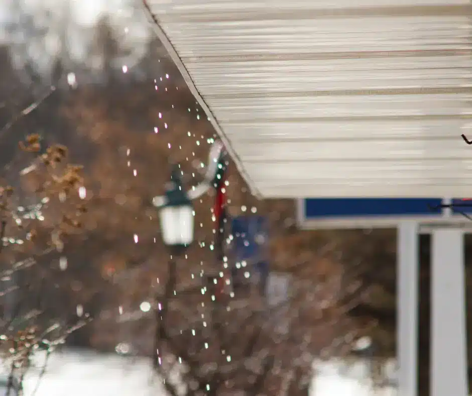 soffits of a house. snow falling in the background.