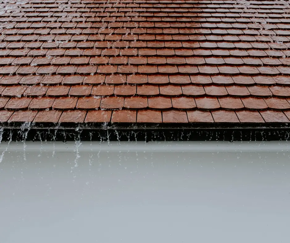 a roof with water falling from it