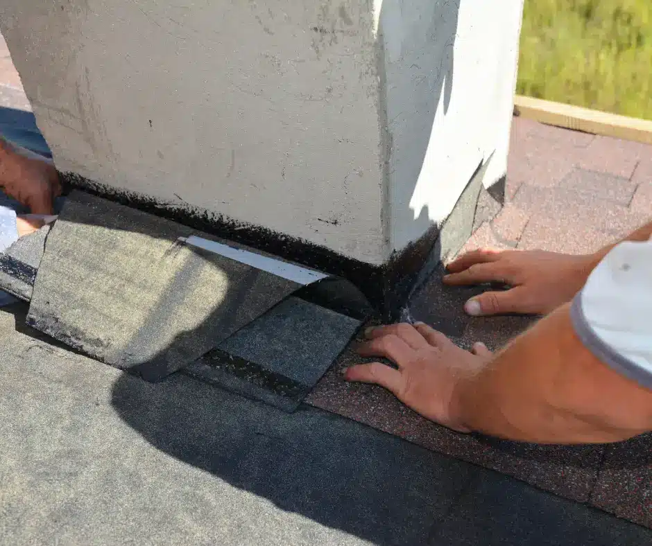 a person installing a roof flashing