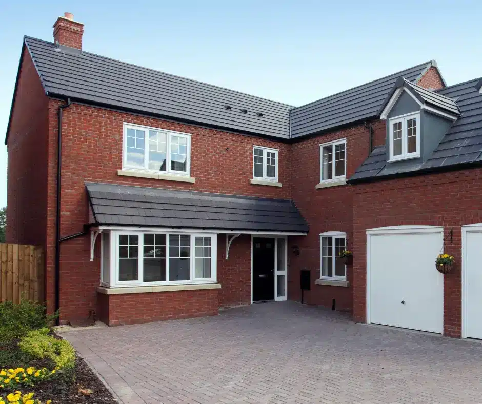 a brick house with aesthetic roof shingle