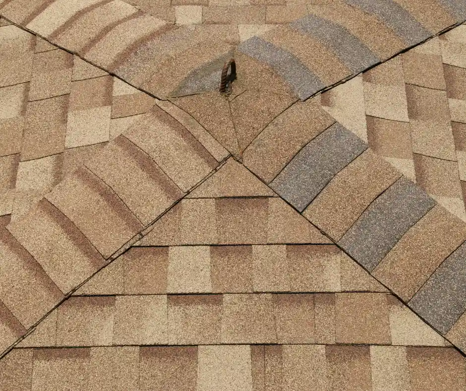 metal roof vs asphalt shingles: a roof with shingles on it