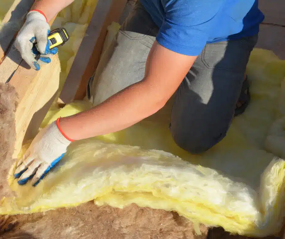 a person installing roof insulation